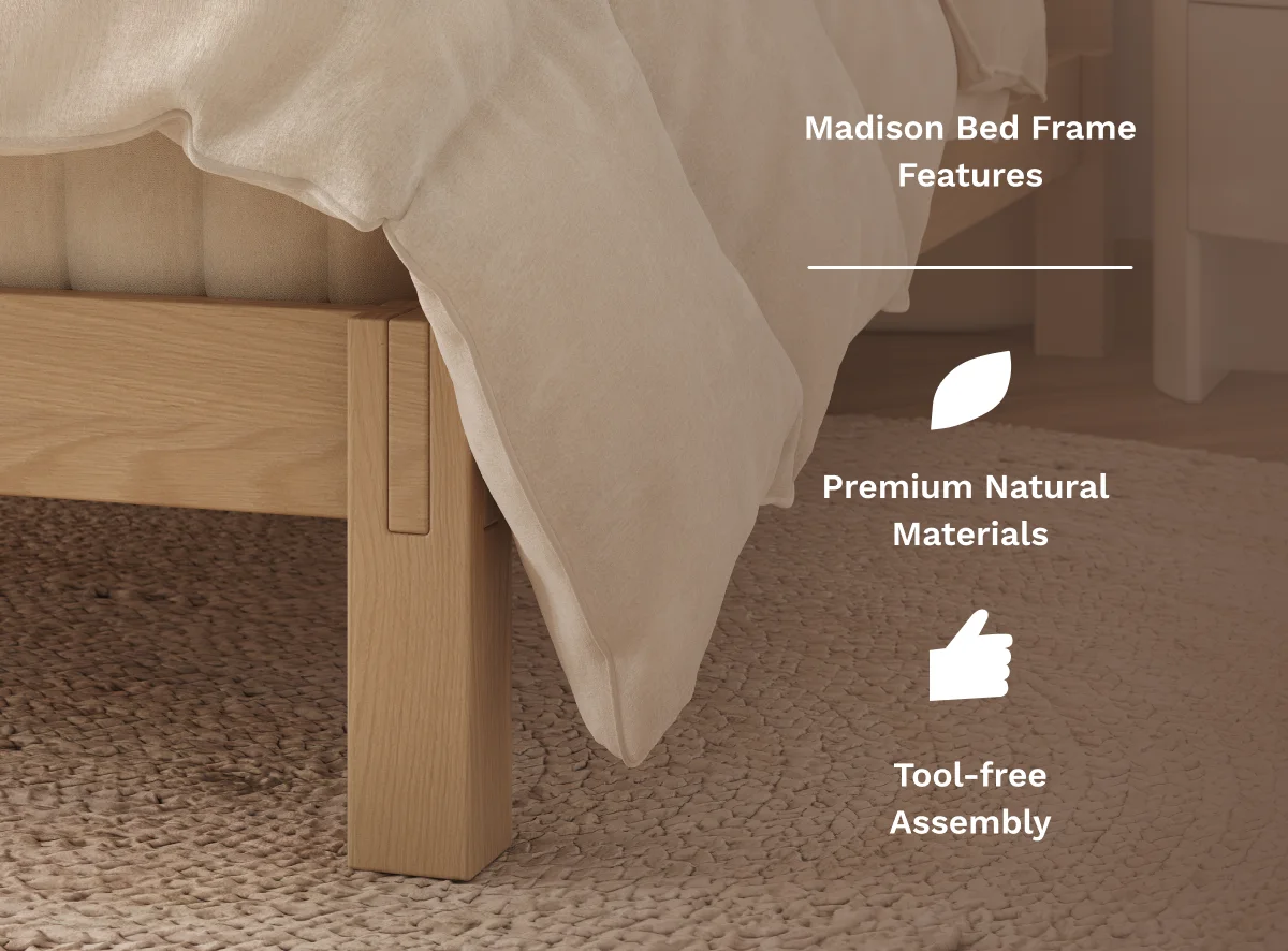 A close-up photo of a queen bed frame with a center support beam and a leg touching the floor, realistic indoor lighting