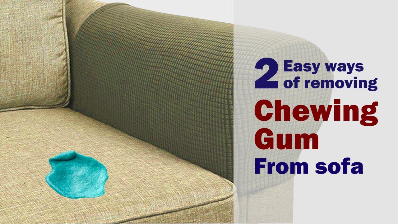 A close-up photo of tweezers carefully lifting a tiny hardened gum fragment from a cream boucle sofa cushion, showing the looped texture