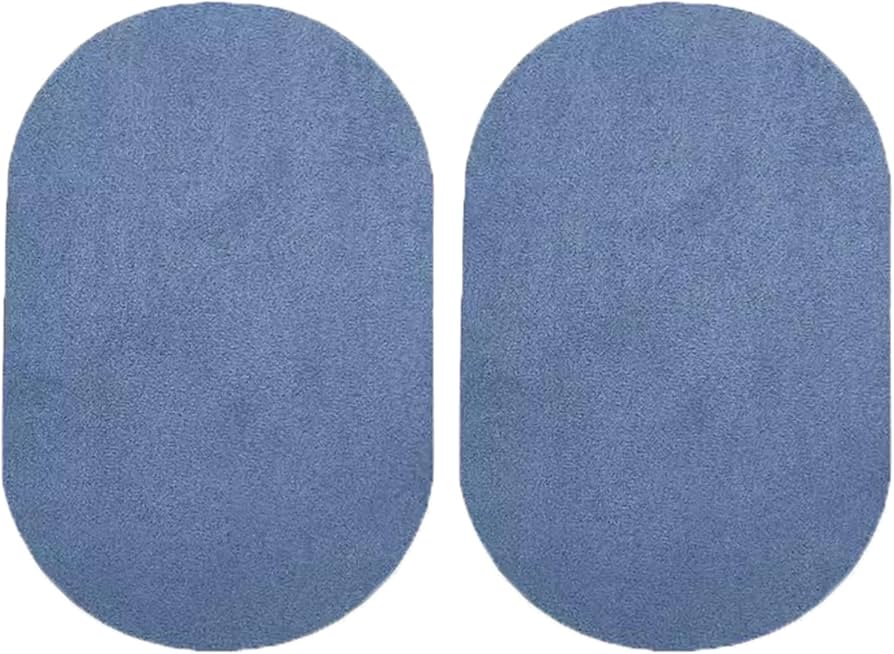 A close-up photograph of a small tear in woven sofa upholstery with a hand holding a fabric adhesive patch near the rip, warm indoor lighting