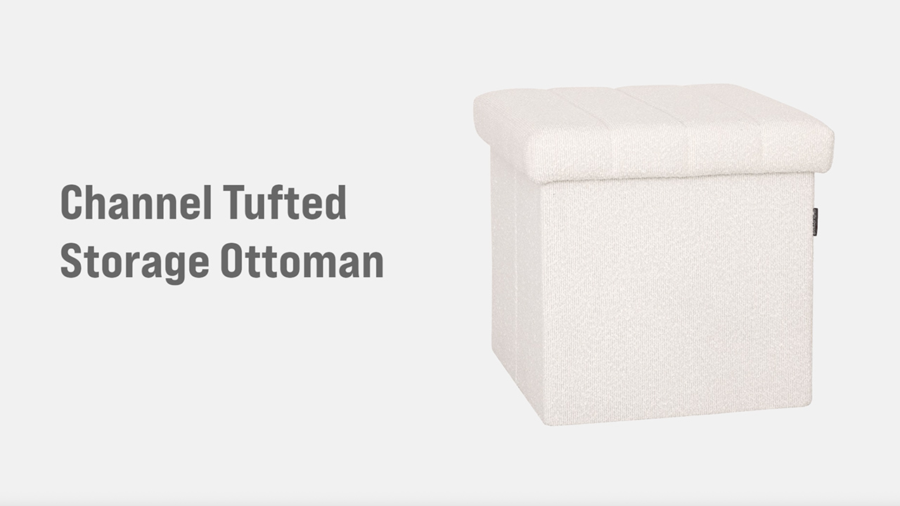 A fabric ottoman gently tipped on its side on towels with a small floor fan blowing across the upholstery to speed drying