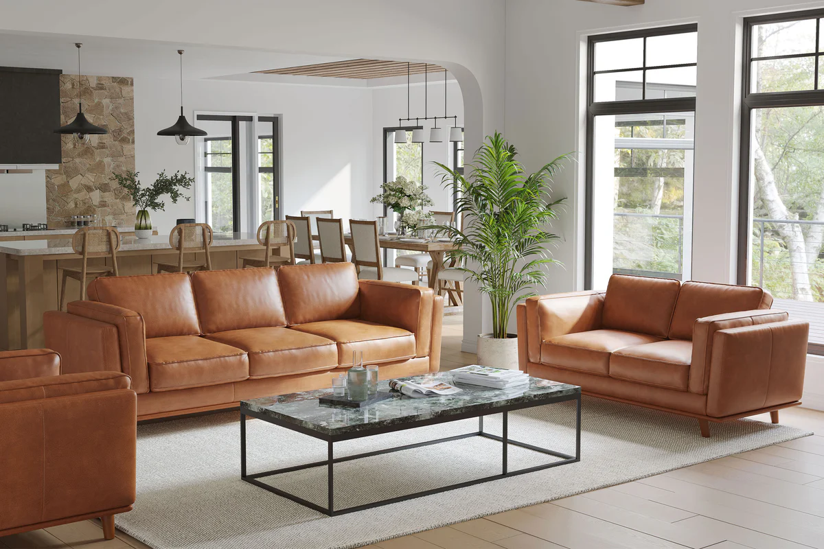 A new caramel leather sofa in a sunlit living room with a window slightly open and soft shadows across the cushions, realistic interior photo