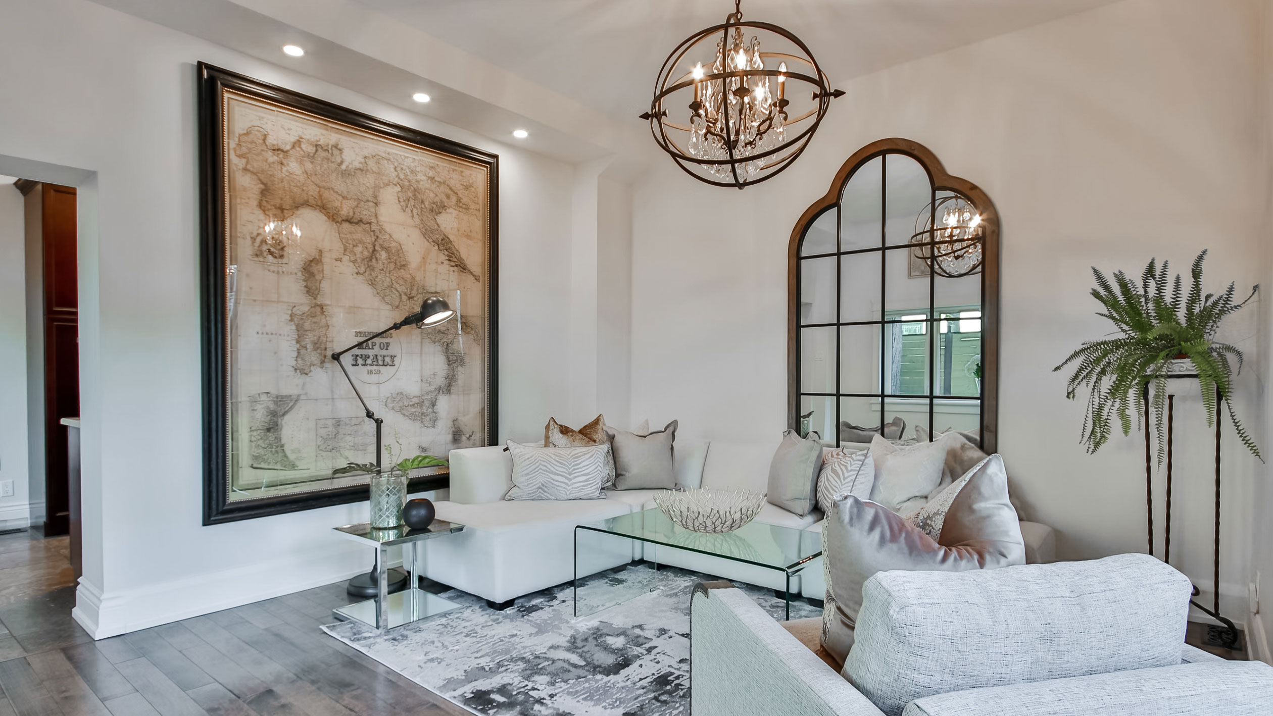 A north-facing bedroom with gray walls and soft daylight from a window, showing a cooler blue cast on the paint, real interior photograph