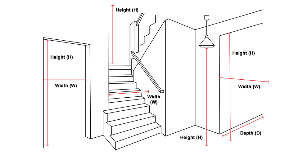 A person holding a tape measure in a narrow apartment hallway while a boxed sofa sits nearby, natural window light, realistic home photography