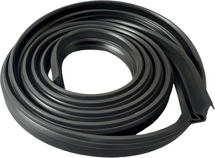 A real dishwasher door partially open while a hand wipes the rubber gasket with a microfiber cloth, close-up photo