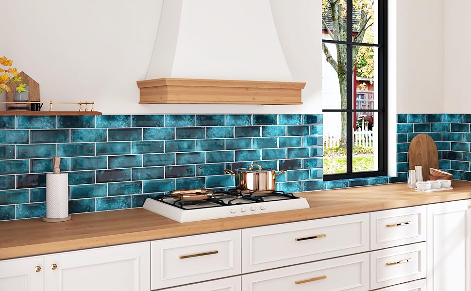 A real photo close-up of hands smoothing a vinyl peel-and-stick subway tile sheet onto a clean kitchen wall, showing subtle texture and a matte white finish