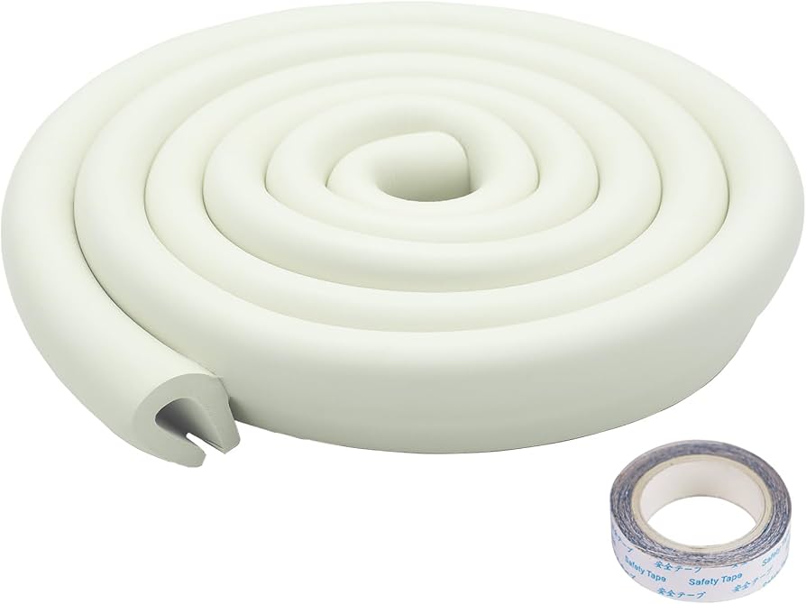 A real photo of a round glass coffee table in a small apartment with a nearly invisible clear silicone edge bumper along the rim and a textured rug underneath