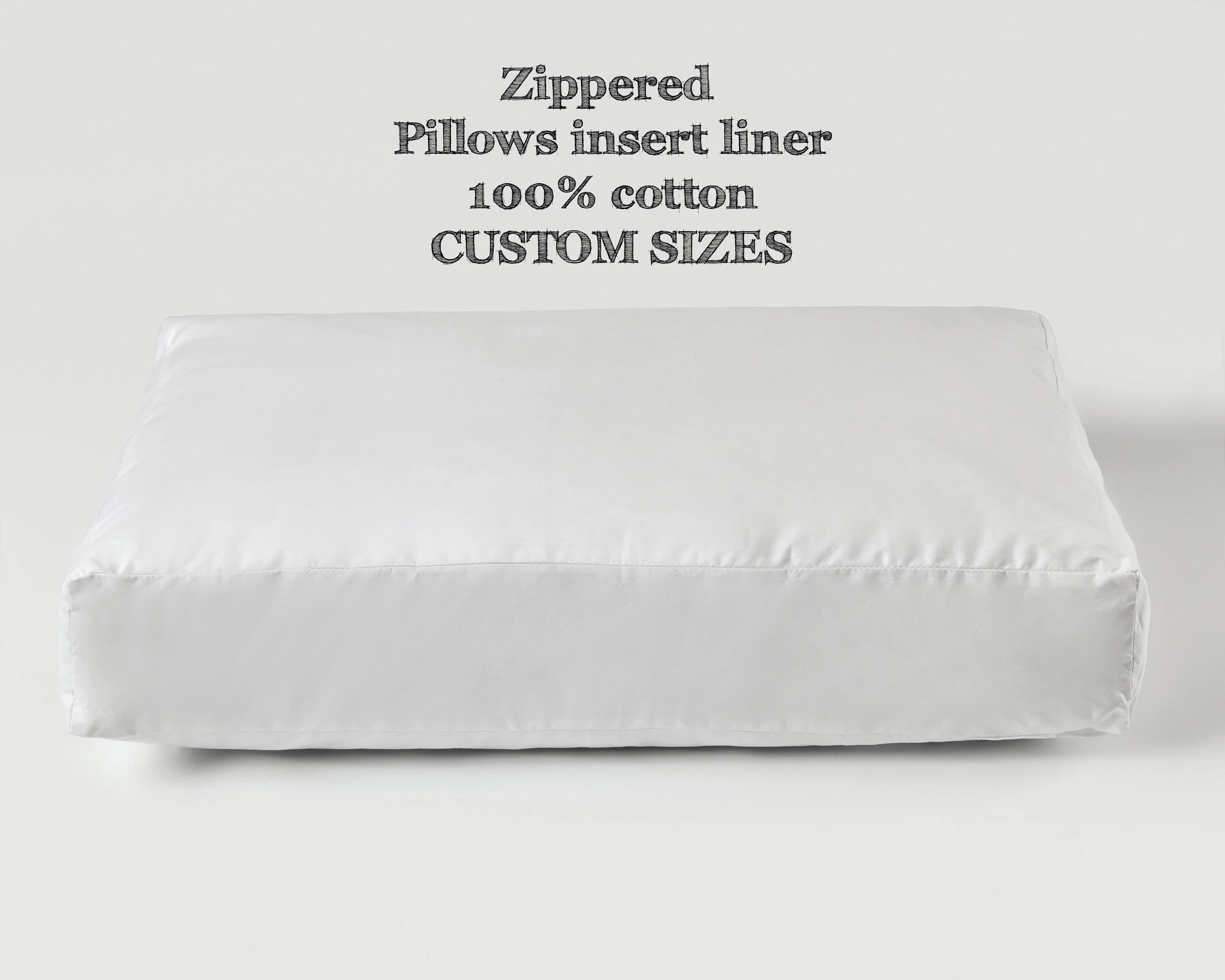 Close-up photo of a large floor pillow with the outer cover opened to show a white inner liner and a sturdy zipper seam