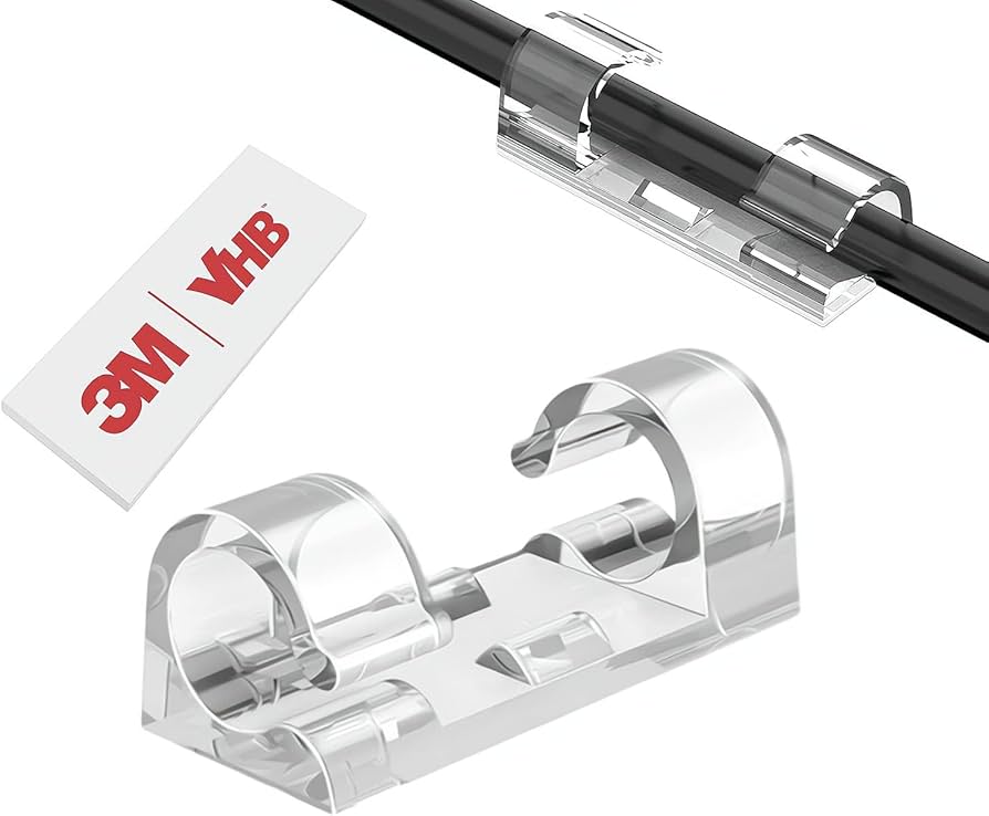 Close-up photo of a white kitchen cabinet underside with a thin light cord neatly secured using small clear cable clips along the back edge