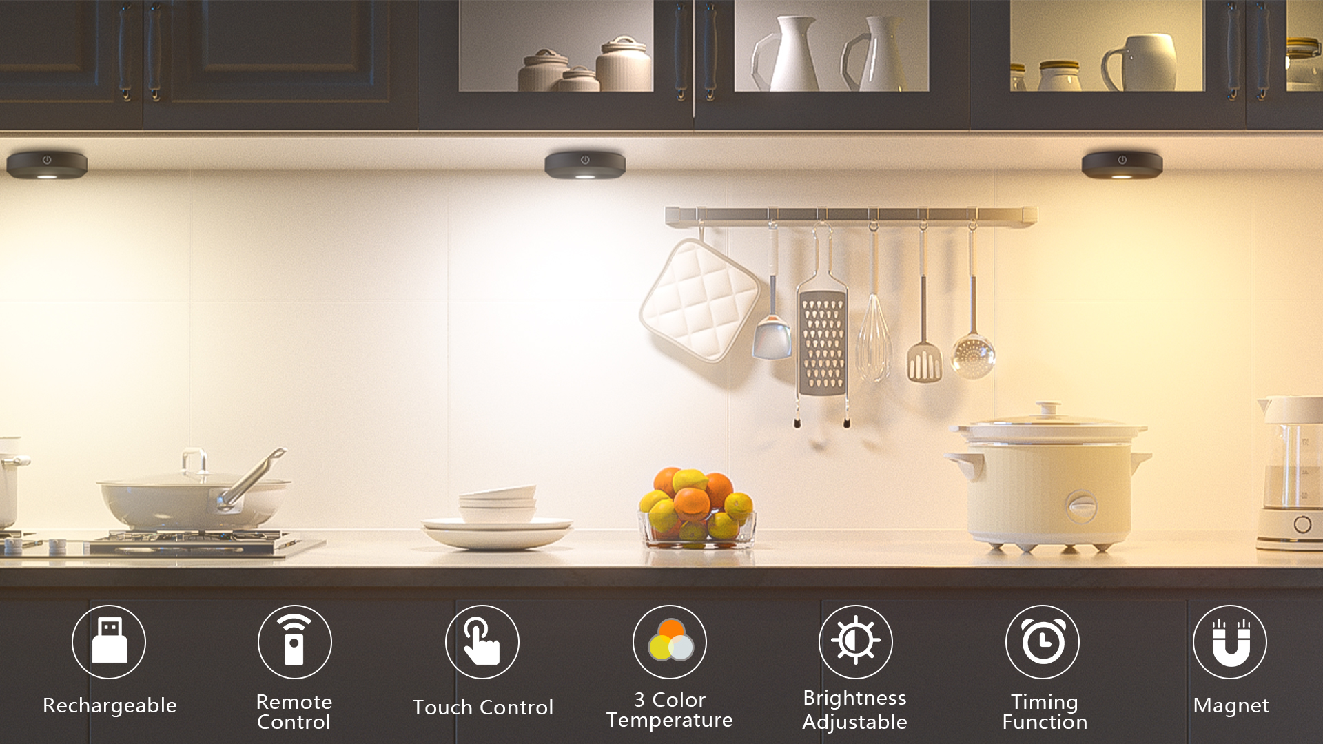 Close-up photo of three small battery puck lights mounted under a white kitchen cabinet, casting soft circles of light onto a stone countertop